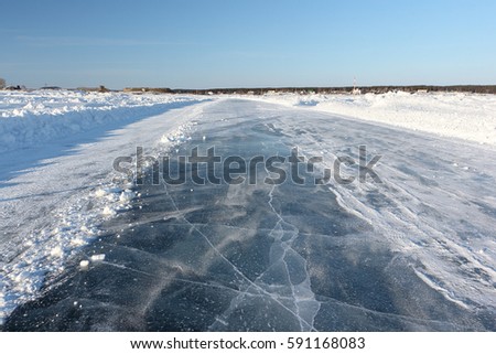 Ice road on a frozen reservoir in the winter,  Ob River, Siberia, Russia