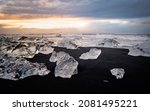 Ice rock with black sand beach at Jokulsarlon beach (Diamond beach) in southeast Iceland
