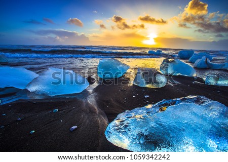 Ice rock with black sand beach at Jokulsarlon beach (Diamond beach) in southeast Iceland
