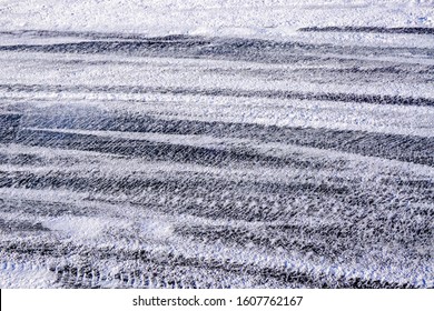 Ice Rugged And Scratched With Studded Tires, Winter Snow Auto Background                               