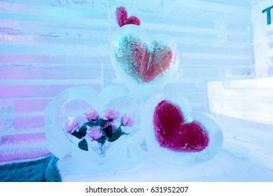 Ice Sculpture Heart. Colored Lights In Background.