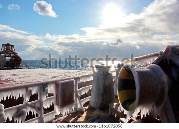 Ice of the ship and ship
structures after sailing in frosty weather during a storm in the
Pacific Ocean. Ice patterns and icicles, the play of light, ice and
sun.