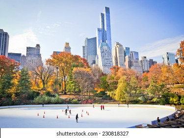 Ice skaters having fun in New York Central Park in fall 