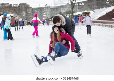 Ice Skating Couple Having Winter Fun On Ice Skates Quebec, Canada.