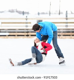 Ice Skating Couple Having Winter Fun On Ice Skates In Old Port, Montreal, Quebec, Canada.