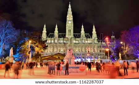 Ice Skating in front of Vienna City Hall (Christmas Time/ Holiday Celebrations) at Night in December - Vienna, Austria 