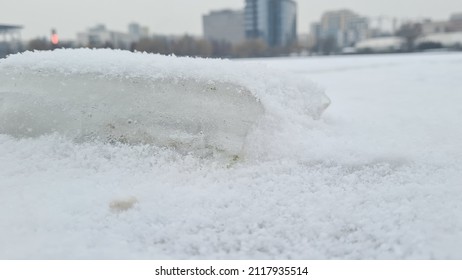 Ice Slab On A Frozen Lake In An Urban Park