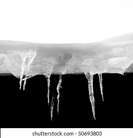 Ice Stalactites On The Side Of A Roof