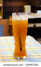 ice tea  with drinking straw on the table ,