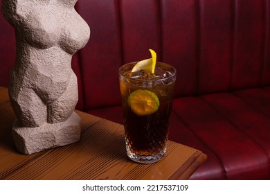 Ice Tea Glass And Woman Sculpture