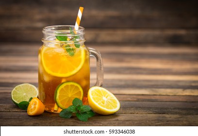 Ice tea with lemon, lime and mint