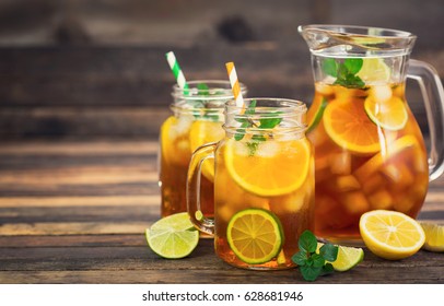 Ice tea with lemon, lime and mint 