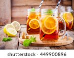 ice tea with slice of lemon in mason jar on the wooden rustic background