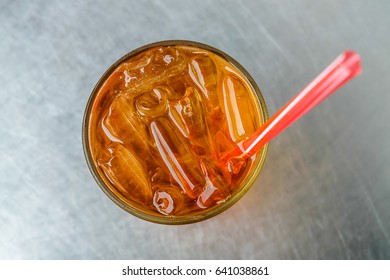 Ice Tea With 
Straw On Stainless Steel Table Background Top View Fresh Concept