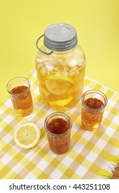 Ice Tea In Three Glasses - An Antique Mason Jar With Sun Tea In The Background.