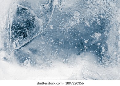 Ice texture background. Textured cold frosty surface of ice block on dark background. - Shutterstock ID 1897220356