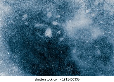 Ice texture background. Textured cold frosty surface of ice on dark background. - Shutterstock ID 1911430336