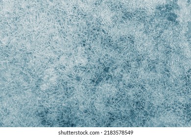 Ice Texture Crystal, Blue Tones Background. The Textured Cold Frosty Surface Of The Ice.