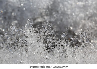 ice texture, frozen snowflakes, icing, melting snow. icicles and a river water