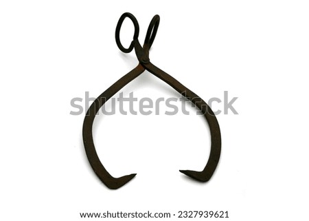 Ice Tongs. Antique Ice Tongs. Isolated on white. Room for text. Clipping path. 1920s -1930s Ice Block tongs. Tongs were used to move blocks of Ice for Freezers before electricity was used. 