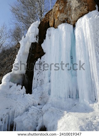 Ice waterfall, frozen water, blue ice, beautiful landscape. High quality photo