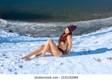 Ice Woman Only In Bikini Enjoying Sun Exposure Winter Day And Bare Skin On Snow