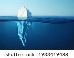 Iceberg in clear blue water and hidden danger under water. Iceberg - Hidden Danger And Global Warming Concept. Floating ice in ocean. Copyspace for text and design