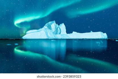 Iceberg floating in greenland fjord  
					with aurora borealis - Greenland