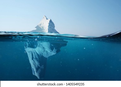 Iceberg in the ocean with a view under water. Crystal clear water. Hidden Danger And Global Warming Concept 