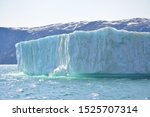 icebergs in the arctic sea from the Eqip Sermia - Eqi Glacier in Greenland. Boat trip in the Disko Bay. World heritage -  extremly affected by global warming and climate change. Summer - July