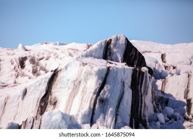 Icebergs Floating. Ices And Volcanic Ash. Glacier Lagoon Jokullsarlon. Big Ice Fall. South Coast Iceland. Volcanic Ash On The Ice. Big Glacier Melting Fast. Global Warming Concept. Arct Landscape. 