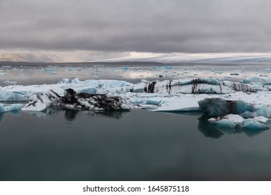 Icebergs Floating. Ices And Volcanic Ash. Glacier Lagoon Jokullsarlon. Big Ice Fall. South Coast Iceland. 
