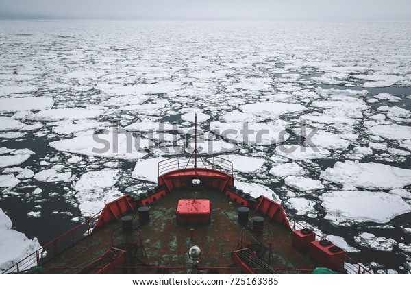 Icebreaker going\
through the ice fields,\
Arctic