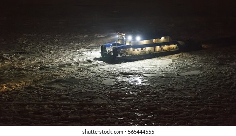 Icebreaker Ship Trapped In Ice At Night Aerial View