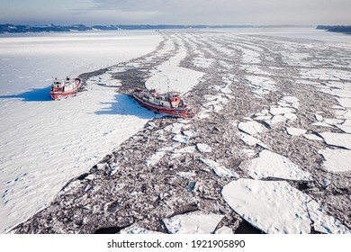 Icebreakers Breaking The Ice On Vistula River, Aerial View Of Poland