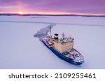 Icebreaking vessel in Arctic with background of sunset