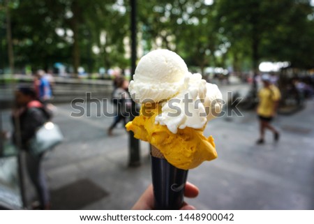 Icecream holding in San Sebastian at the shopping street - Mango and Joghurt - Spain
