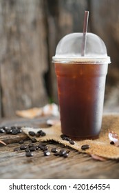 Iced Americano Black Coffee On A Wooden Table