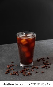 Iced americano coffee with beans background