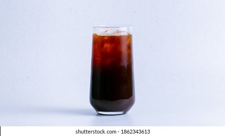 Iced Americano In Glass Isolated On White Background Closeup.