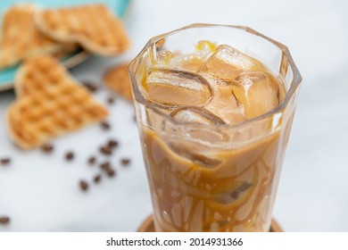 Iced Caramel Latte Coffee In A Tall Glass With Caramel Syrup