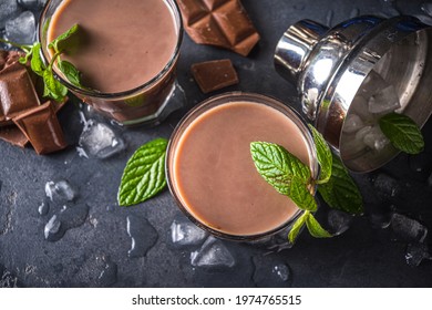 Iced Chocolate Cocktail. Summer Refreshment Drinks. Chilled Iced Chocolate Coco Drink, Latte Coffee. With Ice, Mint And Chocolate Slices On Dark Background Copy Space