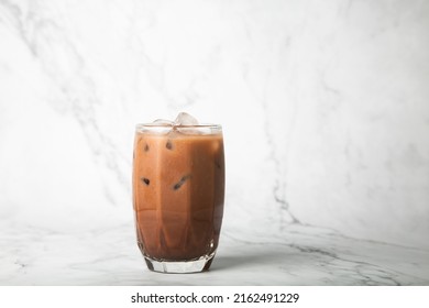 Iced Cocoa In Clear Glass On Marble, Copy Space For Your Text