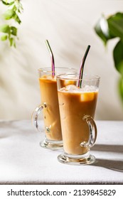 Iced Coffe In Tall Glasses With Colorful Metal Straws