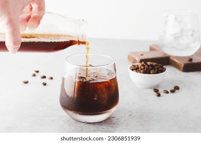 Iced Coffee, Cold Brew Coffee with Ice on Bright Light Grey Background, Refreshing Beverage - Shutterstock ID 2306851939