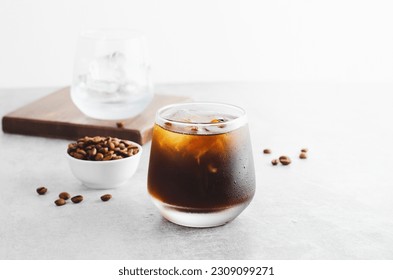 Iced Coffee, Cold Brew Coffee with Ice on Bright Light Grey Background, Refreshing Beverage - Shutterstock ID 2309099271