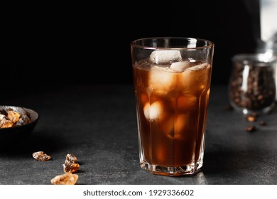 Iced Coffee In A Glass On Black Background. Cold Refreshment Summer Drink.