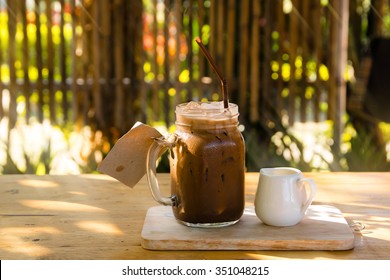 Iced Coffee In Jug, Jar, Mug Glass Cups On The Table