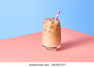 Iced Coffee with Milk in Tall Glasses on Pink Table and Blue Background. Isometric Horizontal Orientation - Powered by Shutterstock