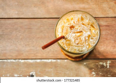 Iced Coffee On Wood Background